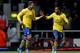 LONDON, ENGLAND - DECEMBER 26: Lukas Podolski of Arsenal (L) celebrates with Theo Walcott as he scores their third goal during the Barclays Premier League match between West Ham United and Arsenal at Boleyn Ground on December 26, 2013 in London, England.