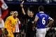 LIVERPOOL, ENGLAND - DECEMBER 26: Tim Howard (L) of Everton receives a red card from referee Lee Probert after fouling Ki Sung-Yueng (not pictured) of Sunderland inside the penalty box during the Barclays Premier League match between Everton and Sunderlan