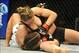 Feb 23, 2013; Anaheim, CA, USA; Ronda Rousey (black shorts) and Liz Carmouche (white shorts) during their UFC women's world bantamweight championship bout at the Honda Center. Mandatory Credit: Jayne Kamin-Oncea-USA TODAY Sports