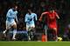 MANCHESTER, ENGLAND - DECEMBER 26: Luis Suarez of Liverpool takes on Joleon Lescott of Manchester City during the Barclays Premier League match between Manchester City and Liverpool at Etihad Stadium on December 26, 2013 in Manchester, England. (Photo b