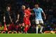 MANCHESTER, ENGLAND - DECEMBER 26: Luis Suarez of Liverpool talks to Vincent Kompany of Manchester City as they walk off for half time during the Barclays Premier League match between Manchester City and Liverpool at Etihad Stadium on December 26, 2013 i