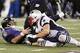 Dec 22, 2013; Baltimore, MD, USA; Baltimore Ravens quarterback Joe Flacco (5) sacked by New England Patriots linebacker Rob Ninkovich (50) at M&T Bank Stadium. Mandatory Credit: Mitch Stringer-USA TODAY Sports