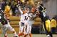 Dec 15, 2013; Pittsburgh, PA, USA; Cincinnati Bengals quarterback Andy Dalton (14) passes the ball over Pittsburgh Steelers defensive end Cameron Heyward (97) during the third quarter at Heinz Field. The Steelers won 30-20. Mandatory Credit: Charles LeCla