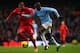 MANCHESTER, ENGLAND - DECEMBER 26: Yaya Toure of Manchester City is closed down by Glen Johnson of Liverpool during the Barclays Premier League match between Manchester City and Liverpool at Etihad Stadium on December 26, 2013 in Manchester, England. (P