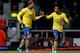 LONDON, ENGLAND - DECEMBER 26: Lukas Podolski of Arsenal (L) celebrates with Theo Walcott as he scores their third goal during the Barclays Premier League match between West Ham United and Arsenal at Boleyn Ground on December 26, 2013 in London, England.