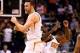 Dec 13, 2013; Phoenix, AZ, USA; Phoenix Suns center Miles Plumlee (left) celebrates with teammate Eric Bledsoe in the fourth quarter against the Sacramento Kings at US Airways Center. The Suns defeated the Kings 116-107. Mandatory Credit: Mark J. Rebilas-