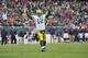 CHICAGO, IL - DECEMBER 16: Aaron Rodgers #12 of the Green Bay Packers after throwing a touchdown pass against the Chicago Bears on December 16, 2012 at Soldier Field in Chicago, Illinois. (Photo by David Banks/Getty Images)