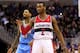 WASHINGTON, DC - DECEMBER 09: John Wall #2 of the Washington Wizards celebrates in front of Wilson Chandler #21 of the Denver Nuggets after hitting a three pointer during the first half at Verizon Center on December 9, 2013 in Washington, DC. NOTE TO US