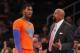 NEW YORK, NY - DECEMBER 25: Iman Shumpert #21 of the New York Knicks talks with head coach Mike Woodson during a game against the Oklahoma City Thunder at Madison Square Garden on December 25, 2013 in New York City. The Thunder defeated the Knicks 123-94.