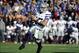 Nov 30, 2013; Lawrence, KS, USA; Kansas State Wildcats quarterback Jake Waters (15) rushes for a touchdown against the Kansas Jayhawks in the second half at Memorial Stadium. Kansas State won the game 31-10. Mandatory Credit: John Rieger-USA TODAY Sports