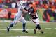 CINCINNATI, OH - DECEMBER 08: Giovani Bernard#25 of the Cincinnati Bengals runs with the ball while defended by Pat Angerer#51 of the Indianapolis Colts during the NFL game at Paul Brown Stadium on December 8, 2013 in Cincinnati, Ohio. (Photo by Andy Ly