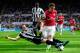 NEWCASTLE UPON TYNE, ENGLAND - MAY 19: Arsenal player Aaron Ramsey (r) is tackled by Mathieu Debuchy of Newcastle during the Barclays Premier League match between Newcastle United and Arsenal at St James' Park on May 19, 2013 in Newcastle upon Tyne, Engl