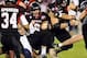 Dec 26, 2013; San Diego, CA, USA; Northern Illinois Huskies quarterback Jordan Lynch (6) is tackled for a loss in the second half against the Utah State Aggies during the 2013 Poinsettia Bowl at Qualcomm Stadium. Mandatory Credit: Christopher Hanewinckel-