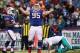 Dec 22, 2013; Orchard Park, NY, USA; Buffalo Bills defensive tackle Kyle Williams (95) celebrates a sack on Miami Dolphins quarterback Ryan Tannehill (17) during the second half at Ralph Wilson Stadium. Buffalo beats Miami 19-0. Mandatory Credit: Timothy