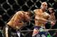 Jul 27, 2013; Seattle, WA, USA; Robbie Lawler (red tape) lands a punch to the head of Bobby Voelker (blue tape) during their welterweight bout at Key Arena. Lawler won by a TKO in the second round. Mandatory Credit: Jayne Kamin-Oncea-USA TODAY Sports