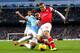 MANCHESTER, ENGLAND - DECEMBER 14: Fernandinho of Manchester City and Jack Wilshere of Arsenal battle for the ball during the Barclays Premier League match between Manchester City and Arsenal at Etihad Stadium on December 14, 2013 in Manchester, England.