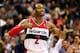 WASHINGTON, DC - DECEMBER 06: John Wall #2 of the Washington Wizards celebrates after making a basket during the closing mintues of regulation against the Milwaukee Bucks at Verizon Center on December 6, 2013 in Washington, DC. The Bucks won 109-105. NOT