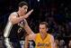 Oct 22, 2013; Los Angeles, CA, USA; Los Angeles Lakers point guard Steve Nash (10) drives the baseline on Utah Jazz center Enes Kanter (0) during first quarter action at Staples Center. Mandatory Credit: Robert Hanashiro-USA TODAY Sports