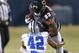 CHICAGO, IL - DECEMBER 09: Martellus Bennett #83 of the Chicago Bears tries to break a tackle by Barry Church #42 of the Dallas Cowboys at Soldier Field on December 9, 2013 in Chicago, Illinois. The Bears defeated the Cowboys 45-28. (Photo by Jonathan Da