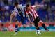 BARCELONA, SPAIN - SEPTEMBER 23: Iker Muniain (R) of Athletic Club duels for the ball with David Lopez of RCD Espanyol during the La Liga match between RCD Espanyol and Athletic Club at Cornella-El Prat Stadium on September 23, 2013 in Barcelona, Spain.