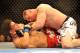 LAS VEGAS - JULY 11: Brock Lesnar holds down Frank Mir during their heavyweight title bout during UFC 100 on July 11, 2009 in Las Vegas, Nevada. (Photo by Jon Kopaloff/Getty Images)