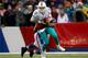 ORCHARD PARK, NY - DECEMBER 22: Ryan Tannehill #17 of the Miami Dolphins is sacked during NFL game action by Mario Williams #94 of the Buffalo Bills at Ralph Wilson Stadium on December 22, 2013 in Orchard Park, New York. (Photo by Tom Szczerbowski/Getty I