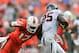 Nov 23, 2013; Miami Gardens, FL, USA; Miami Hurricanes linebacker Tyriq McCord (17) tackles Virginia Cavaliers running back Kevin Parks (25) during the third quarter at Sun Life Stadium. Mandatory Credit: Steve Mitchell-USA TODAY Sports