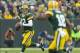 Dec 2, 2012; Green Bay, WI, USA; Green Bay Packers quarterback Aaron Rodgers (12) looks to throw a pass to wide receiver Randall Cobb (18) during the fourth quarter against the Minnesota Vikings at Lambeau Field. The Packers defeated the Vikings 23-14.