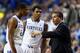LEXINGTON, KY - NOVEMBER 25: John Calipari the head coach of the Kentucky Wildcats talks with Aaron Harrison #2 and Andrew Harrison #5 during the game against the Cleveland State Vikings at Rupp Arena on November 25, 2013 in Lexington, Kentucky. (Photo