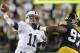 IOWA CITY, IOWA - OCTOBER 20: Quarterback Matt McGloin #11 of the Penn State Nittany Lions drops back for a pass during the first quarter in front of defensive lineman Darian Cooper #97 of the Iowa Hawkeyes on October 20, 2012 at Kinnick Stadium in Iowa