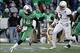 Dec 27, 2013; Annapolis, MD, USA; Marshall Thundering Herd quarterback Rakeem Cato (12) runs with the ball as Maryland Terrapins linebacker Yannick Ngakoue (7) chases in the second quarter during the 2013 Military Bowl at Navy Marine Corps Memorial Stadiu