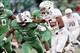 Dec 27, 2013; Annapolis, MD, USA; Maryland Terrapins running back Brandon Ross (45) carries the ball as Marshall Thundering Herd linebacker Stefan Houston (3) chases in the third quarter during the 2013 Military Bowl at Navy Marine Corps Memorial Stadium.