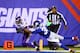 EAST RUTHERFORD, NJ - OCTOBER 21: Wide receiver Jerome Simpson #81 of the Minnesota Vikings cannot make the catch as cornerback Trumaine McBride #38 of the New York Giants defends during a game at MetLife Stadium on October 21, 2013 in East Rutherford, Ne