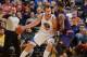 OAKLAND, CA - DECEMBER 27: Andrew Bogut #12 of the Golden State Warriors controls the ball against Markieff Morris #11 of the Phoenix Suns on December 27, 2013 at Oracle Arena in Oakland, California. NOTE TO USER: User expressly acknowledges and agrees th