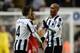 NEWCASTLE UPON TYNE, ENGLAND - NOVEMBER 30: Yoan Gouffran of Newcastle United celebrates scoring the opening goal with team-mate Yohan Cabaye during the Barclays Premier League match between Newcastle United and West Bromwich Albion at St James' Park on