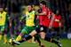 NORWICH, ENGLAND - DECEMBER 28: Nathan Redmond of Norwich City battles with Michael Carrick of Manchester United during the Barclays Premier League match between Norwich City and Manchester United at Carrow Road on December 28, 2013 in Norwich, England.