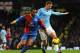 MANCHESTER, ENGLAND - DECEMBER 28: Jason Puncheon of Crystal Palace competes with Edin Dzeko of Manchester City during the Barclays Premier League match between Manchester City and Crystal Palace at the Etihad Stadium on December 28, 2013 in Manchester,