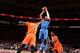 NEW YORK, NY - DECEMBER 25: Russell Westbrook #0 of the Oklahoma City Thunder shoots against Amar'e Stoudemire #1 of the New York Knicks during a game at Madison Square Garden in New York City on December 25, 2013. NOTE TO USER: User expressly acknowledg