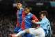 MANCHESTER, ENGLAND - DECEMBER 28: David Silva of Manchester City tangles with Adrian Mariappa of Crystal Palace during the Barclays Premier League match between Manchester City and Crystal Palace at the Etihad Stadium on December 28, 2013 in Manchester,