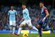 MANCHESTER, ENGLAND - DECEMBER 28: Joel Ward of Crystal Palace competes with David Silva of Manchester City during the Barclays Premier League match between Manchester City and Crystal Palace at the Etihad Stadium on December 28, 2013 in Manchester, Engl