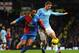MANCHESTER, ENGLAND - DECEMBER 28: Jason Puncheon of Crystal Palace competes with Edin Dzeko of Manchester City during the Barclays Premier League match between Manchester City and Crystal Palace at the Etihad Stadium on December 28, 2013 in Manchester,