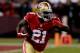 SAN FRANCISCO, CA - DECEMBER 23: Running back Frank Gore #21 of the San Francisco 49ers carries the ball against the Atlanta Falcons during a game at Candlestick Park on December 23, 2013 in San Francisco, California. (Photo by Stephen Dunn/Getty Images
