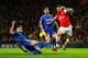 LONDON, ENGLAND - DECEMBER 23: Gary Cahill of Chelsea tackles Olivier Giroud of Arsenal during the Barclays Premier League match between Arsenal and Chelsea at Emirates Stadium on December 23, 2013 in London, England. (Photo by Shaun Botterill/Getty Ima