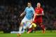 MANCHESTER, ENGLAND - DECEMBER 26: Alvaro Negredo of Manchester City beats Martin Skrtel of Liverpool to the ball during the Barclays Premier League match between Manchester City and Liverpool at Etihad Stadium on December 26, 2013 in Manchester, England