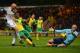NORWICH, ENGLAND - DECEMBER 15: John Ruddy of Norwich saves from Jonjo Shelvey of Swansea as Seb Bassong of Norwich dives in during the Barclays Premier League match between Norwich City and Swansea City at Carrow Road on December 15, 2013 in Norwich, En