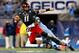 CHARLOTTE, NC - DECEMBER 28: Brandon Ellerbe #20 of the North Carolina Tar Heels sacks Brendon Kay #11 of the Cincinnati Bearcats during their game at Bank of America Stadium on December 28, 2013 in Charlotte, North Carolina. (Photo by Streeter Lecka/Ge