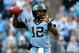 CHARLOTTE, NC - DECEMBER 28: Marquise Williams #12 of the North Carolina Tar Heels drops back to pass during their game against the Cincinnati Bearcats at Bank of America Stadium on December 28, 2013 in Charlotte, North Carolina. (Photo by Streeter Leck