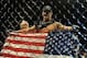 Jul 6, 2013; Las Vegas, NV, USA; Chris Weldman (blue shorts) in the cage after defeating Anderson Silva during their Middleweight Chamionship Bout at the MGM Grand Garden Arena. Chris Weidman defeated Anderson in a TKO in the second round. Mandatory Cred