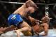 Dec 28, 2013; Las Vegas, NV, USA; Chris Weidman (red gloves) and Anderson Silva (blue gloves) fight during their UFC middleweight championship bout at the MGM Grand Garden Arena. Weidman won. Mandatory Credit: Jayne Kamin-Oncea-USA TODAY Sports