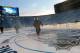 ANN ARBOR, MI - DECEMBER 28: Members of the ice crew do a flood during the 2014 Bridgestone NHL Winter Classic Build-out on December 28, 2013 at Michigan Stadium in Ann Arbour, Michigan. (Photo by Dave Sandford/NHLI via Getty Images)